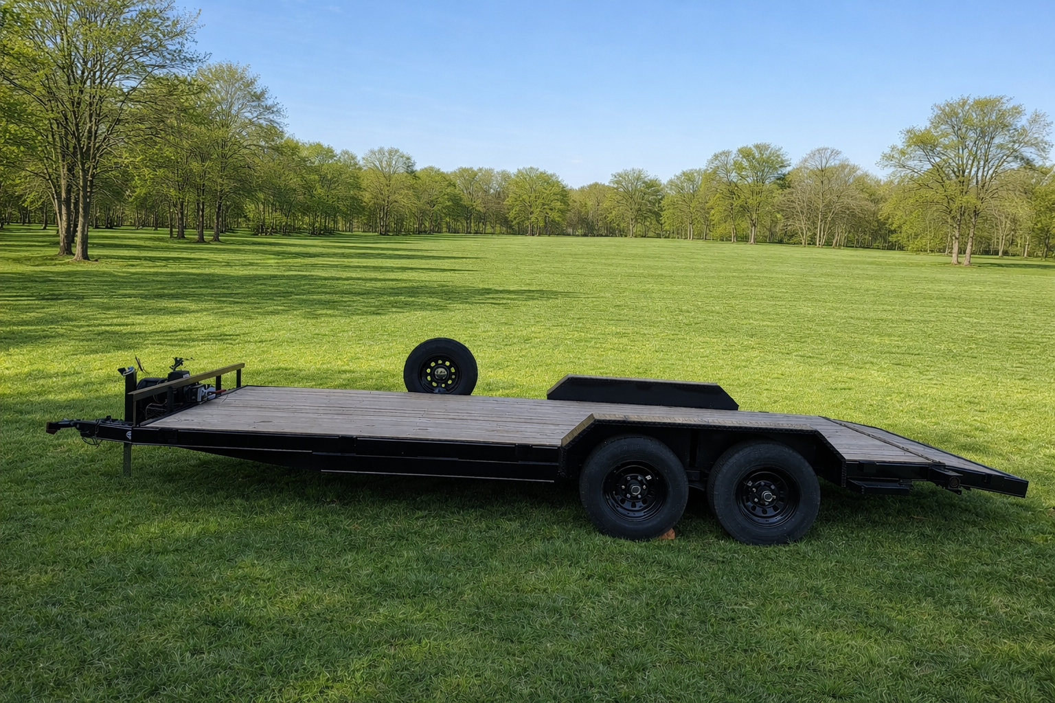 20ft Car hauler trailer in field with spare tire