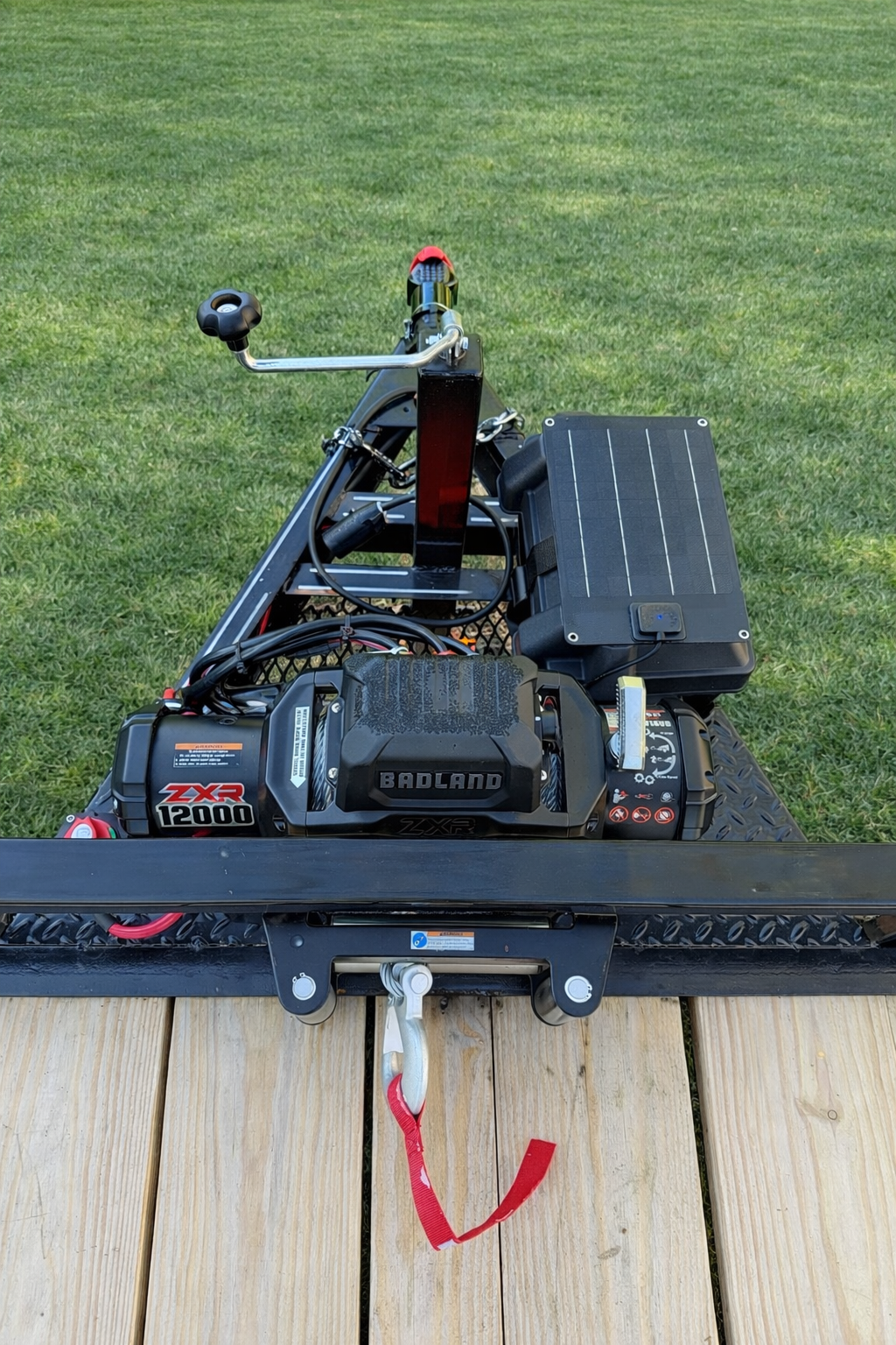 Car hauler Badland winch and solar panel closeup