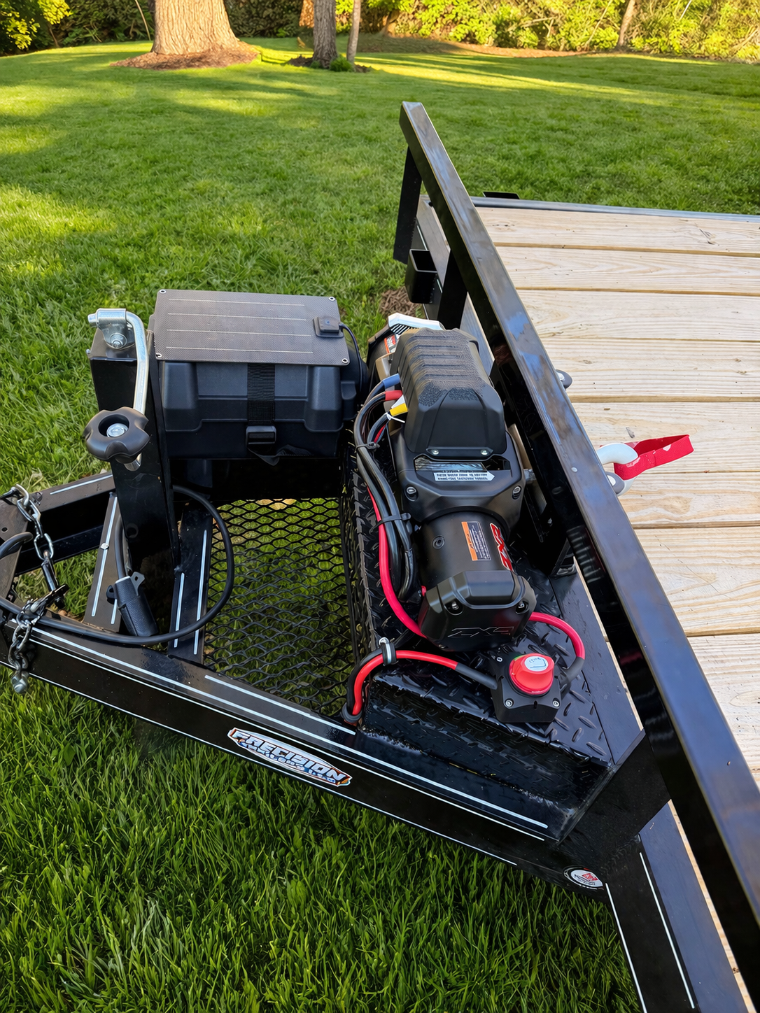 Car hauler winch compartment and toolboxes