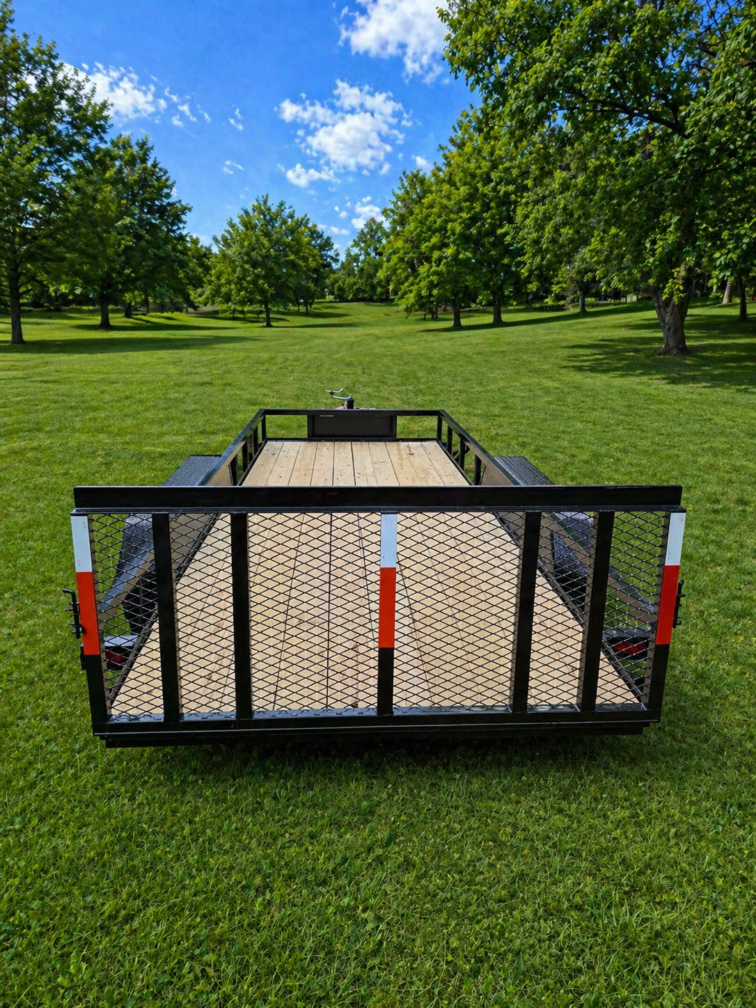 KL utility trailer rear view showing mesh tailgate and reflectors